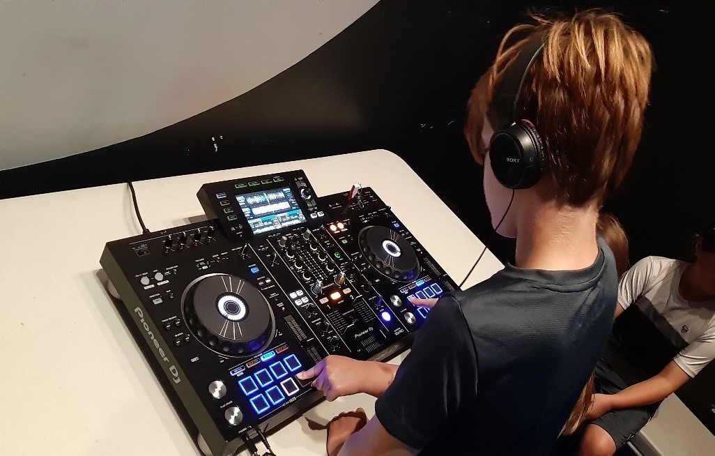 Young person on a DJ deck