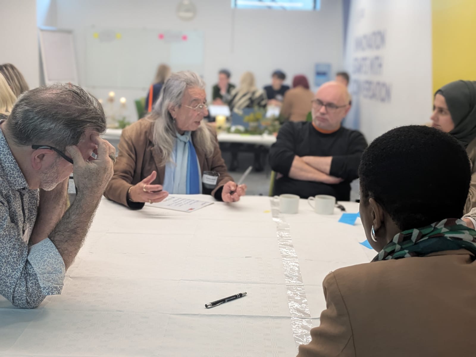 Attendees in a table discussion