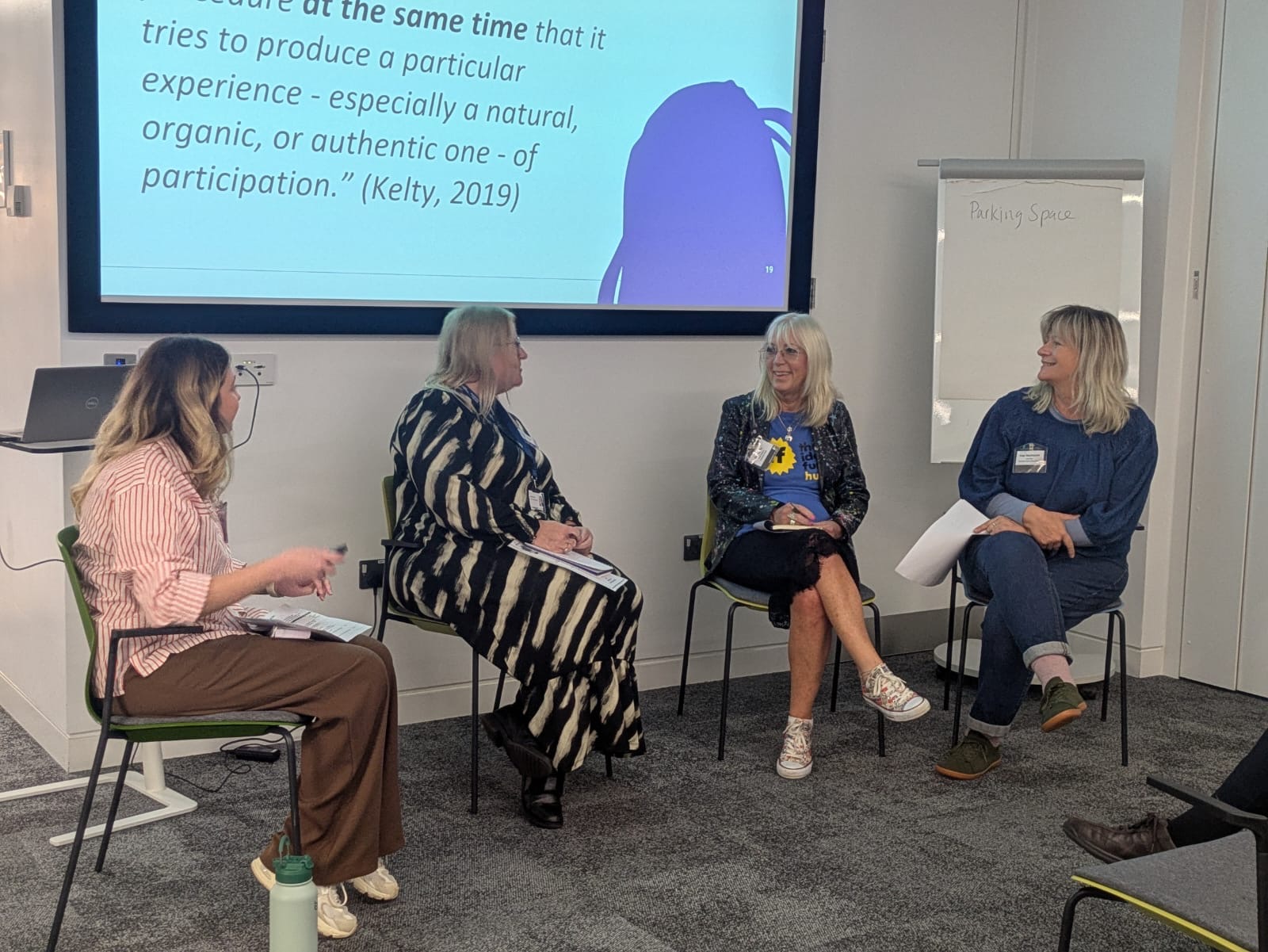 4 women sitting at the front for a panel discussion