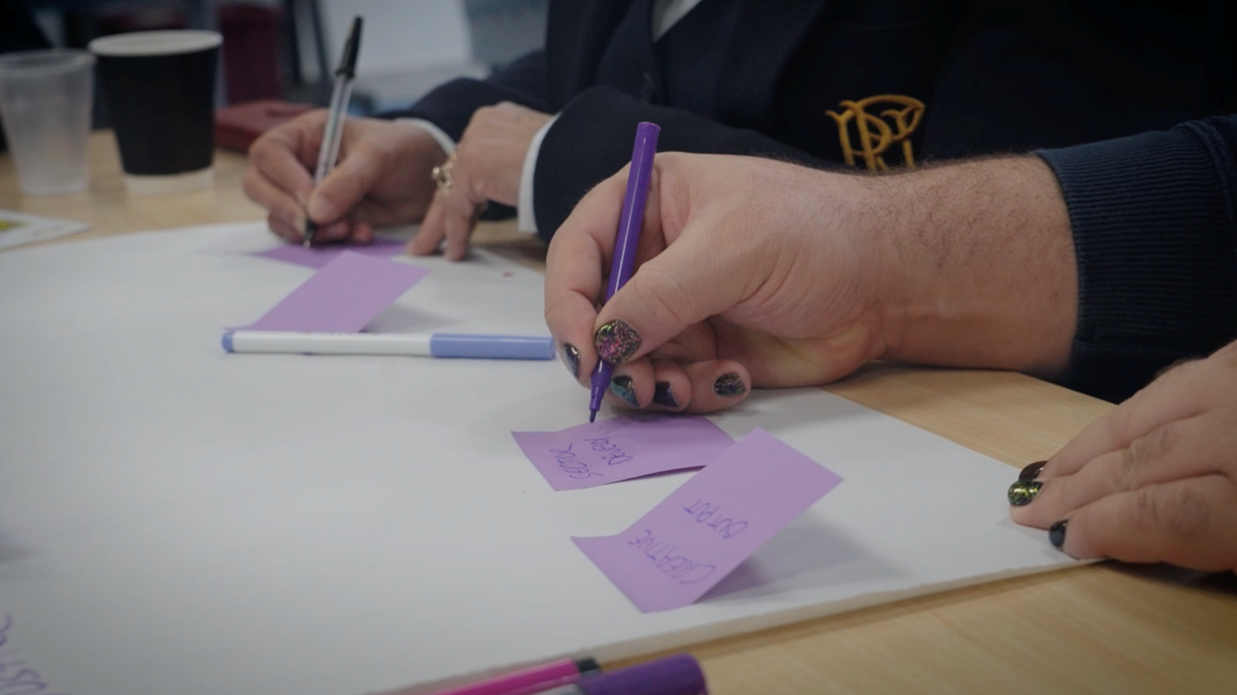 Hand writing on a post-it note