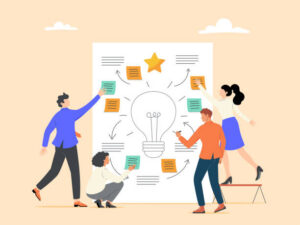 sheet of paper with a big light bulb and post-it notes on with 4 people crowding around it.